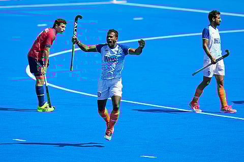Amit Rohidas celebrates after winning the men's bronze medal